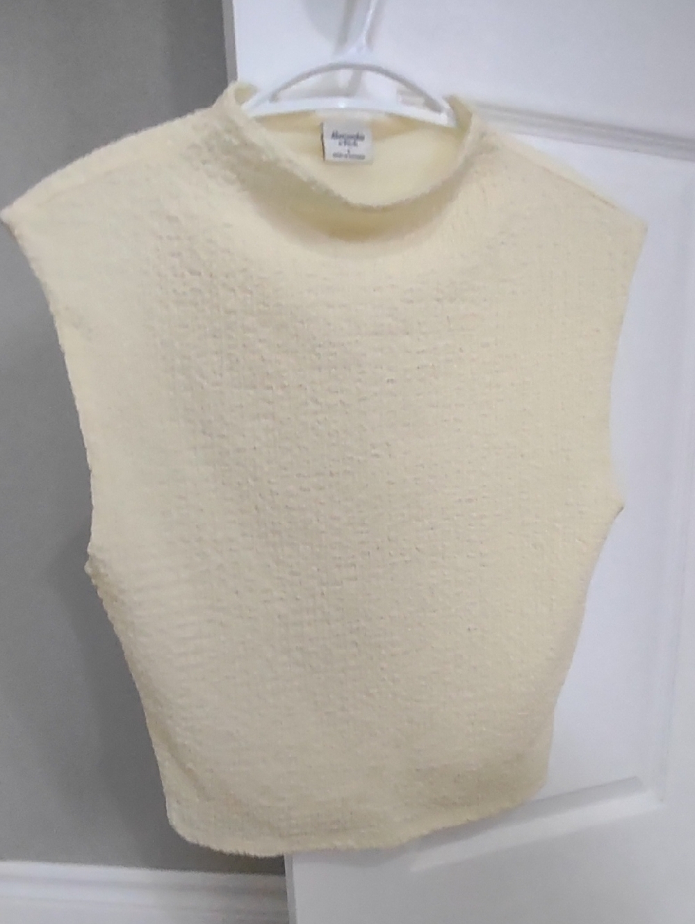 Sleeveless Cream Textured Mock-Neck Top